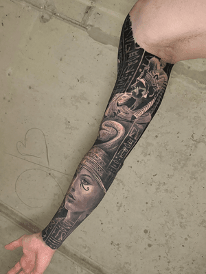 black and grey egyptian full sleeve realistic and surrealistic tattoo with cleopatra anubis hieroglyph pyramds, best tattoo artist london uk