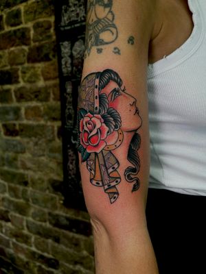 Beautiful and vibrant neo-traditional tattoo featuring a gypsy woman with roses, by the talented artist Barney Coles.
