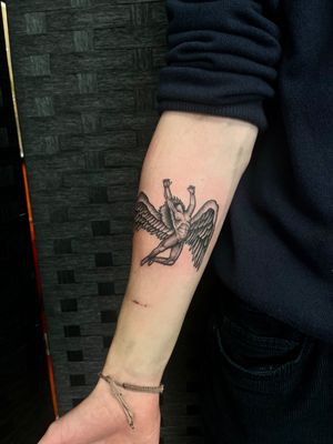 Illustrative black and gray tattoo depicting a fallen angel, beautifully executed by the talented artist Dan Hague.