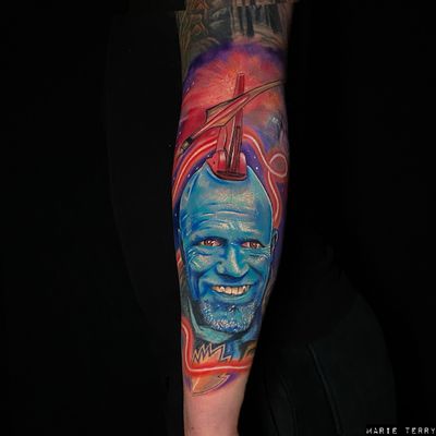 Marvel at the realistic portrayal of Yondu from Guardians of the Galaxy tattooed by Marie Terry, capturing his iconic blue skin and fin mohawk.