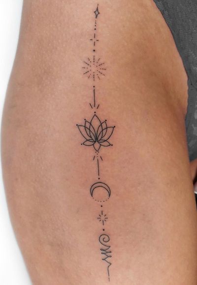 Elegant ornamental design by Liberty C Tattoo, featuring a detailed lotus motif. Perfect for those seeking a delicate and sophisticated tattoo.