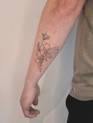 An abstract fine line tattoo by Alexey featuring a single-line fairy and delicate flower motif.