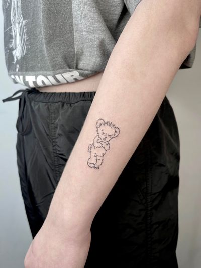 Experience the beauty of fine line art with this adorable bear and cub tattoo design by the talented artist Alina Amberland.