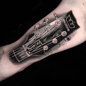 Memorial tattoo of relatives guitar