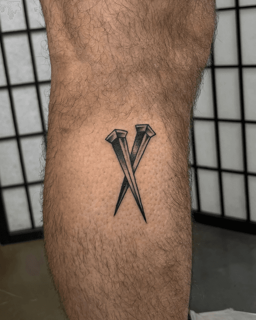 Crossed Nails Tattoo