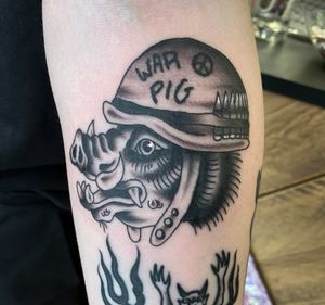 Traditional tattoo of a soldier pig, beautifully designed by Megan Foster.