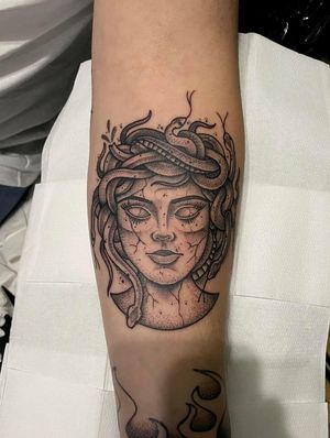 Capture the mythical allure with this illustrative black and gray tattoo by Ryan McKenzie, featuring a snake, Medusa, and stone in unique dotwork style.