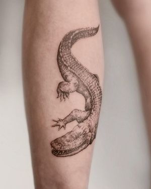 Get a stunning black and gray illustrative alligator tattoo by George Francis for a unique and powerful look.