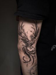 Black and grey phoenix tattoo symbolising rebirth, transformation and resilience. Designed with flowing feathers and dynamic movement.