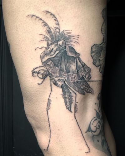 Impressive black and gray tattoo featuring a samurai battling a knight with a mosquito and rapier in the illustration. By Amandine Canata.
