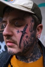 Dagger Tattoo on Face