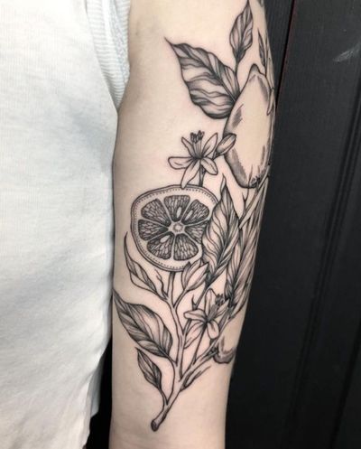 Unique tattoo design featuring a lemon tree branch with flowers and fruits, by Amandine Canata. Stunningly detailed and beautifully executed.