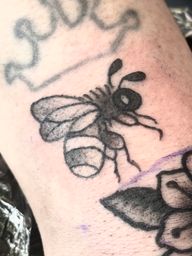 Small bee tattoo