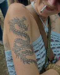 it's not too late! you could still be vibe maxxing at the festival with a cool dragon tattoo of your own! healed dragon summer 🌞🐉