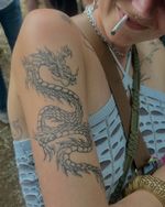 it's not too late! you could still be vibe maxxing at the festival with a cool dragon tattoo of your own! healed dragon summer 🌞🐉