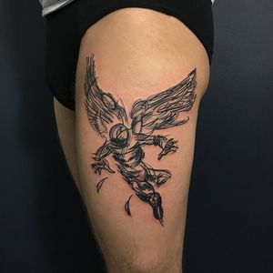 Check out this stunning black and gray tattoo of wings on a man's upper leg, done by the talented artist Sandro Secchin.