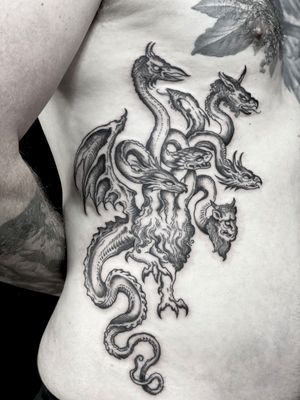 Black and grey illustrative tattoo by Amandine Canata, featuring a menacing medieval hydra creature.