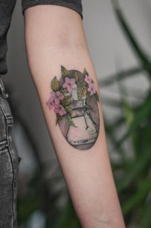 Capture the beauty of nature and caffeine with this detailed illustrative tattoo featuring a flower, coffee cup, a30, and vase. Created by the talented artist Maria.
