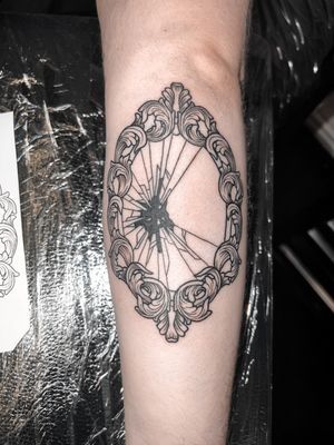 Alexandra Mulhall's blackwork and fine line tattoo features intricate filigree and woodcut engraving designs in a medieval style.