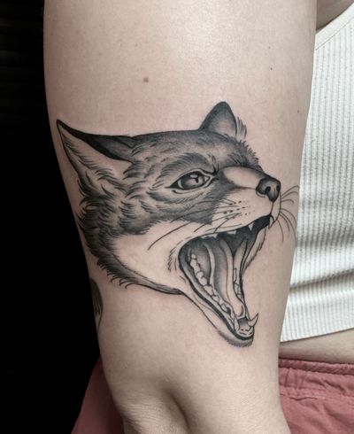 Illustrative black and gray tattoo of a fox, intricately detailed by Amandine Canata.