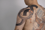 Snake and Floral Shoulder Tattoo