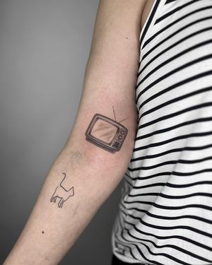 Detailed black and gray TV tattoo featuring dotwork and fine line techniques, created by Marissa Boulay.