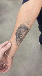 Fine Line Lion and Floral Tattoo
