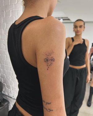 Get inked with a stunning blackwork and dotwork sacred heart design by the talented artist Ellie Shearer.