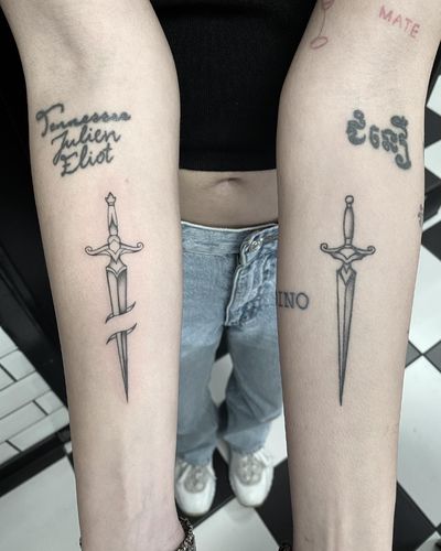 Classic black and gray dagger design expertly executed by talented artist Amandine Canata. Perfect blend of traditional and illustrative styles.