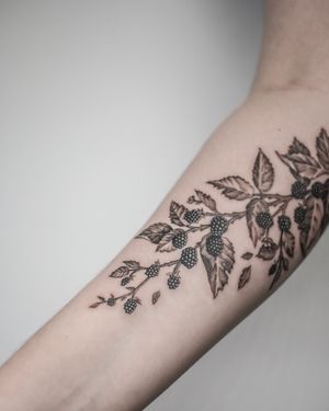 Explore nature's beauty with this black_and_gray illustrative tattoo of a blackberry tree branch by George Francis. A unique and intricate design that captures the essence of the outdoors.