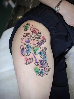 Get lost in Wonderland with this fine line, illustrative, watercolor tattoo of the mischievous Cheshire Cat from Disney's Alice in Wonderland.