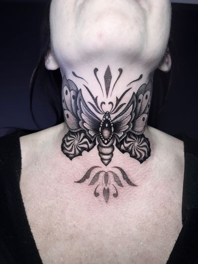 Unique dotwork and illustrative style tattoo featuring a delicate moth and sparkling jewel, expertly executed by tattoo artist Hamid.