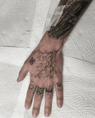 Lightning Bolt Hand Tattoo