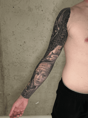 black and grey egyptian full sleeve realistic and surrealistic tattoo with cleopatra anubis hieroglyph pyramds, best tattoo artist london uk