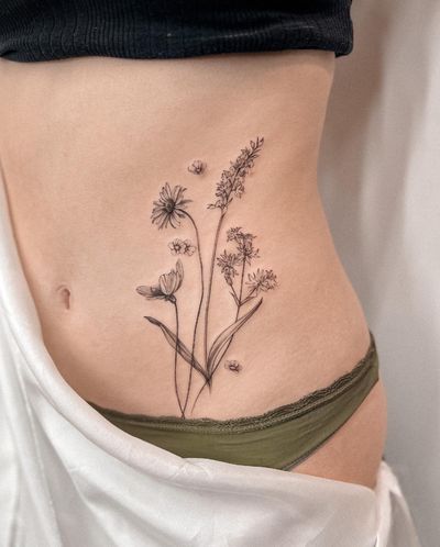 Elegant and intricate floral design by Alex Caldeira, perfect for a subtle yet beautiful tattoo.