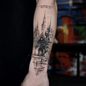 Sasha Davydova created a black and gray abstract tattoo of a gothic castle, perfect for covering up old ink.