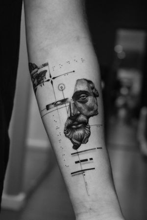 Experience the beauty and precision of this black and gray tattoo featuring a Greek statue in a geometric and realistic style. By Light Grays.