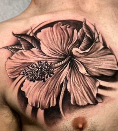 Elegant black and gray illustrative hibiscus flower tattoo, expertly inked by renowned artist Justin JP Param.