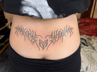 Neotribal Spiky Heart Lower Back Tattoo