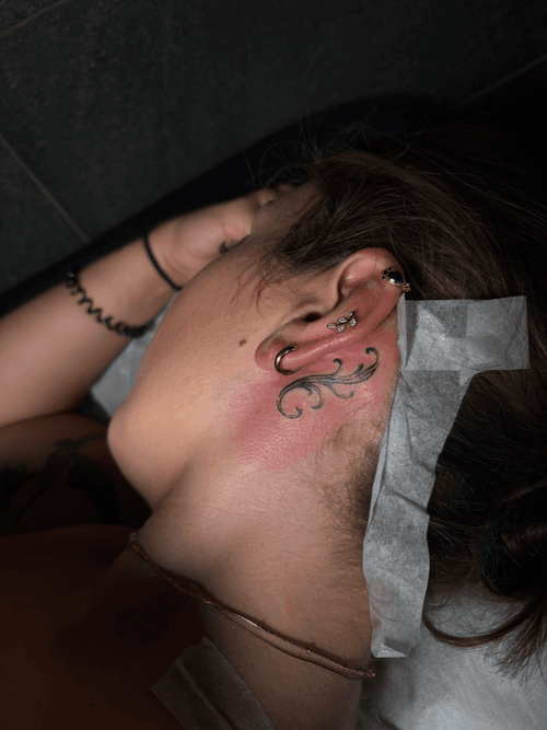 Delicate Swirl Behind Ear Tattoo