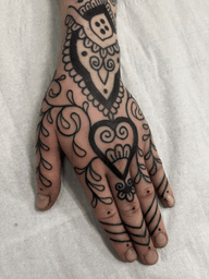 A stunning ornamental blackwork tattoo by Claudia Vicente, featuring an intricate pattern design. Perfect for those seeking a unique and bold tattoo statement.