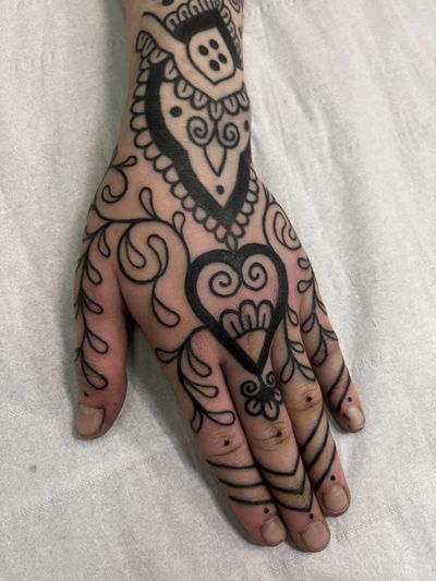 A stunning ornamental blackwork tattoo by Claudia Vicente, featuring an intricate pattern design. Perfect for those seeking a unique and bold tattoo statement.