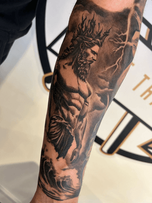 A stunning black and gray realism tattoo featuring Poseidon and Zeus from Greek mythology, skillfully done by Epic Tattoos Guildford.