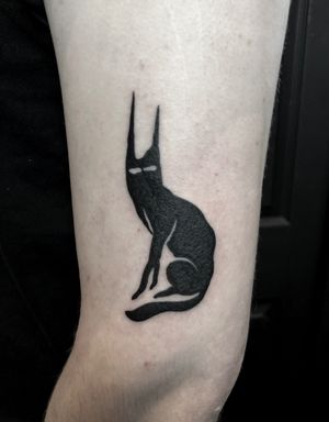 Get inked with this stylish blackwork design of Le Chat Noir by talented artist Amandine Canata. Perfect for cat lovers!