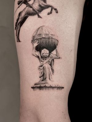 Intricate black and gray micro-realism tattoo of the Greek mythological figure Atlas, by Saka Tattoo.