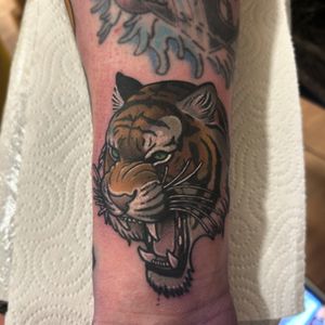 Roar with style! Show off this fierce neo traditional tiger tattoo by Lawrence Canham.