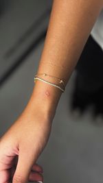 Tiny Red Heart Outline Tattoo