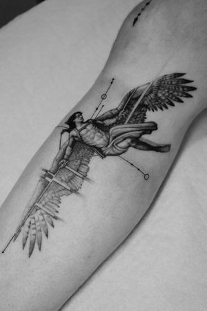 This black and gray fine line geometric tattoo pays homage to Greek mythology with a stunning micro-realism depiction of Icarus.