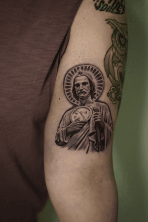 Detailed black and gray micro-realism religious tattoo by artist Kenny Go.