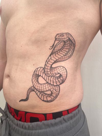 Get inked with a fierce cobra tattoo designed in illustrative style by the talented artist Michelle Harrison.